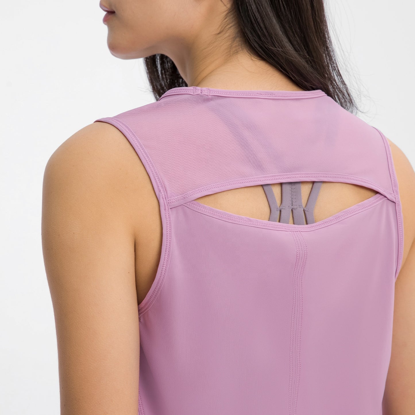 Women's Sports Vests & Yoga Tank Tops - Hollow Mesh Out Back. This super comfortable tank top is made from nylon and spandex breathable materials that are durable, quick-dry and have great stretchable abilities giving you a comfortable and flexible feel. Its suitable for jogging, yoga, gym and is comfortable for leisure wear.